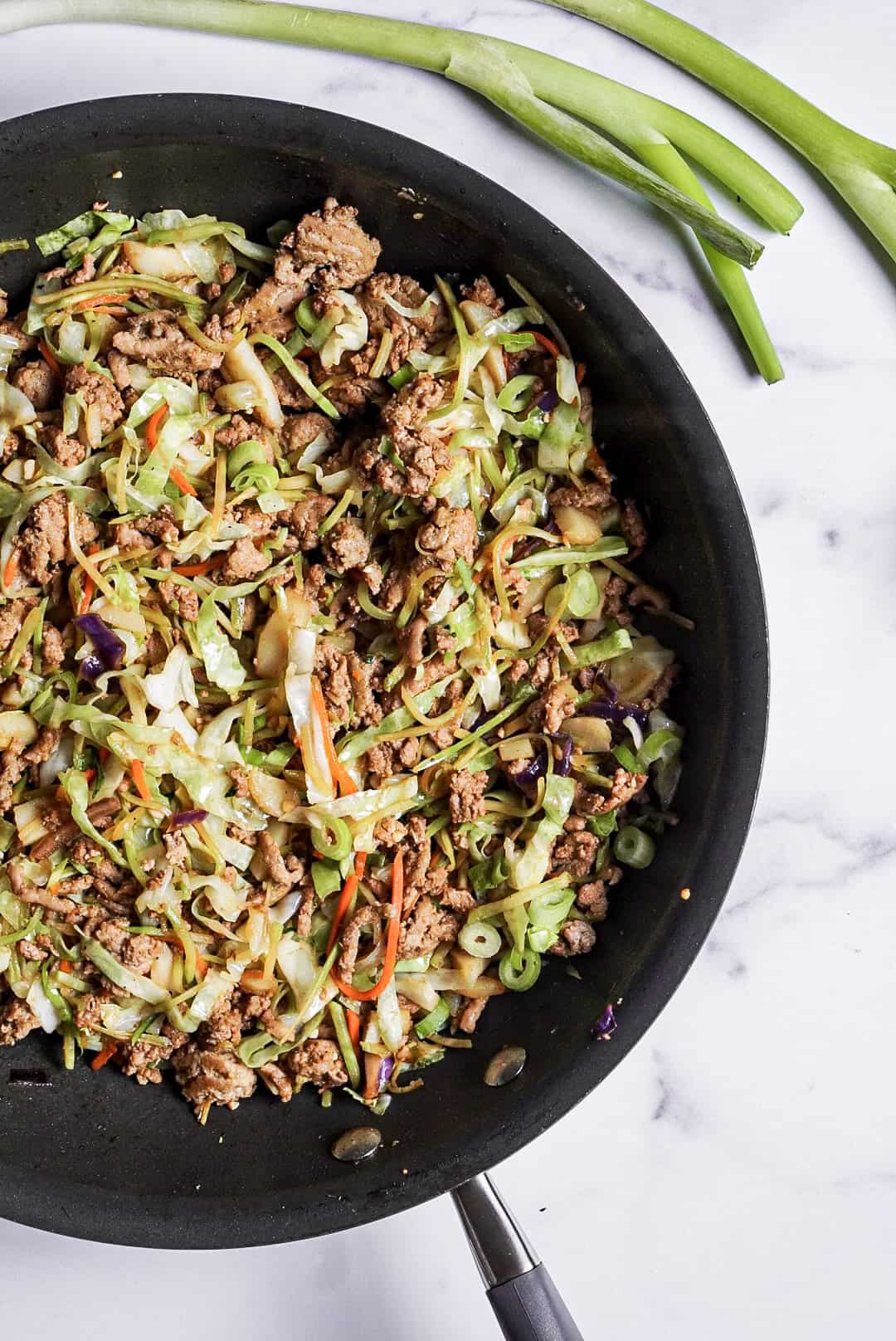 Skillet of high protein egg roll in a bowl ingredients.