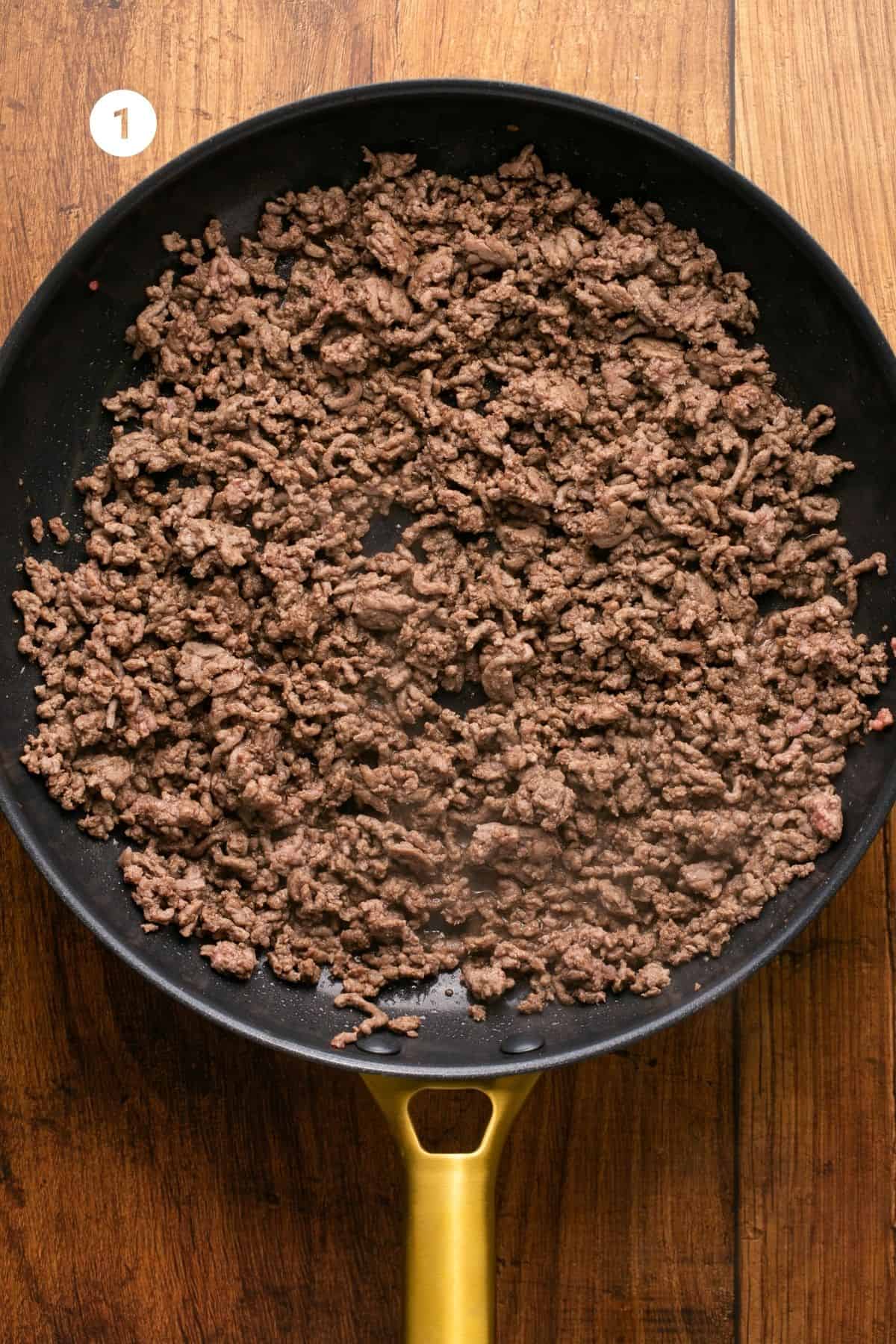 Ground beef cooked in a pan. 