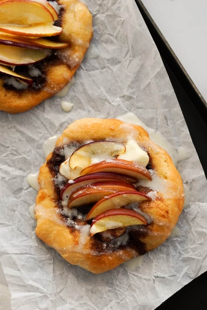 Pumpkin pie apple danish on parchment paper.