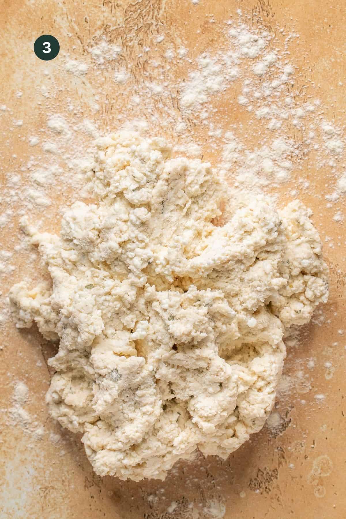 Sticky cottage cheese dough on a floured surface. 