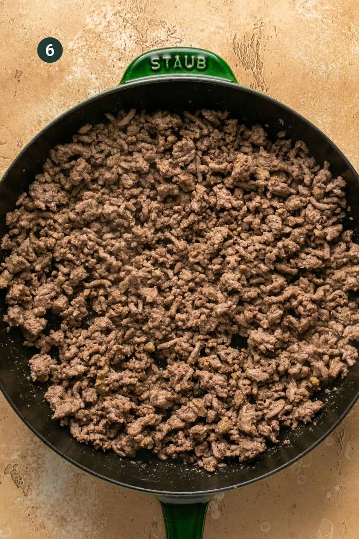 Ground beef, mustard, garlic powder, onion powder, salt and pepper cooked in a skillet and combined. 