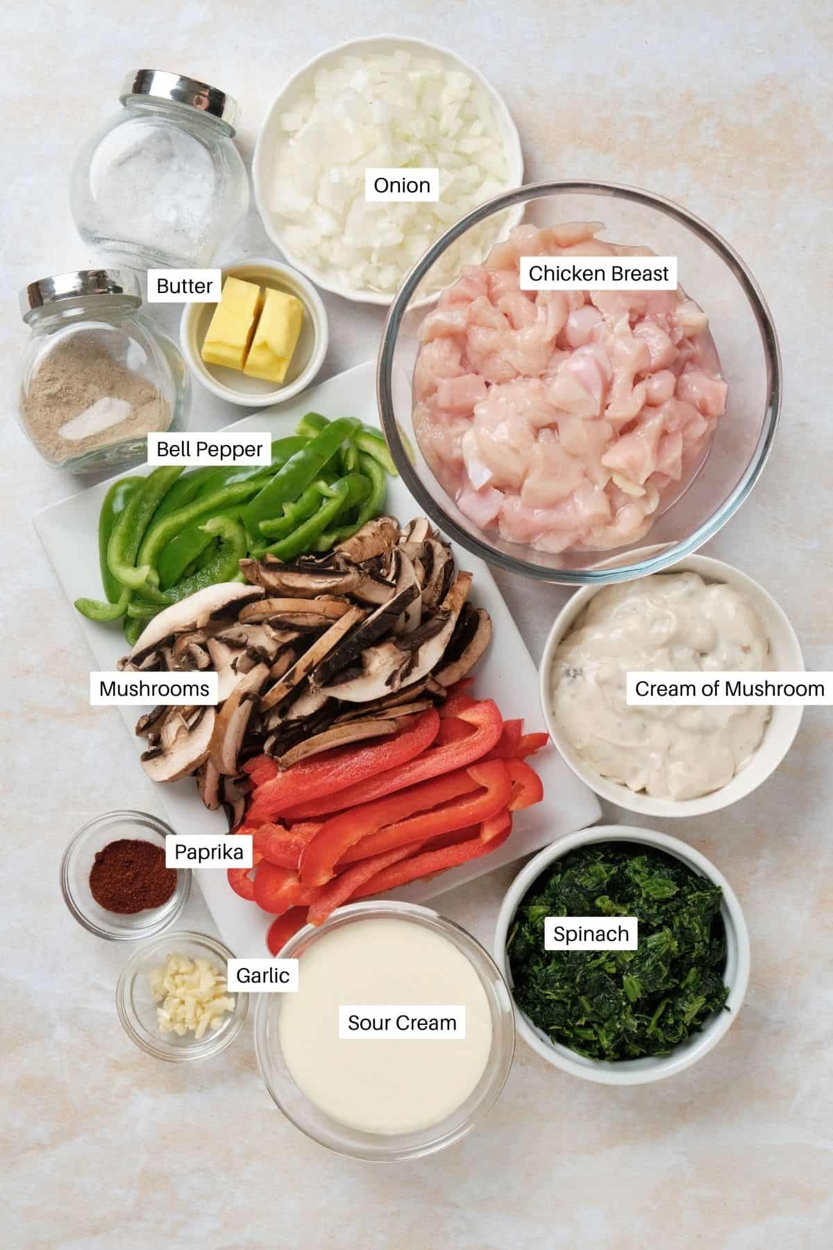 Casserole ingredients including mushrooms, peppers, and sour cream.