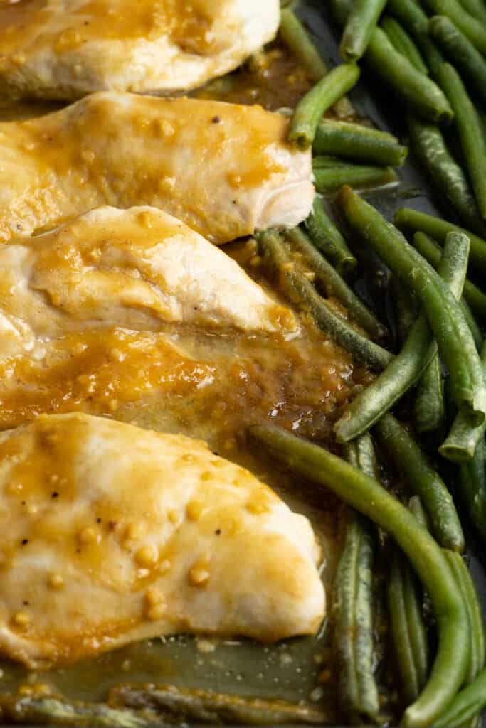 Sheet pan of chicken and green beans.