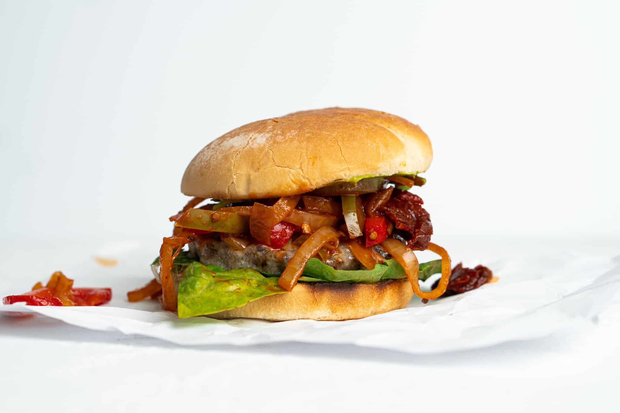 Fajita burger on parchment paper.