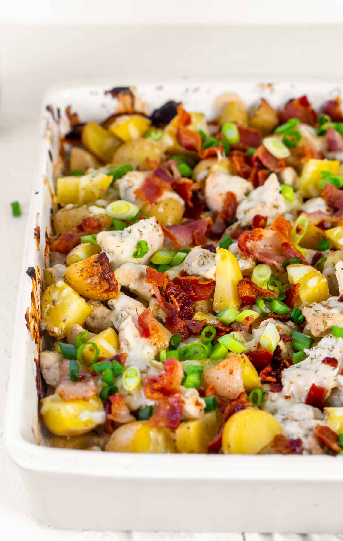 Fully baked casserole of potatoes, bacon, chicken and green onions.