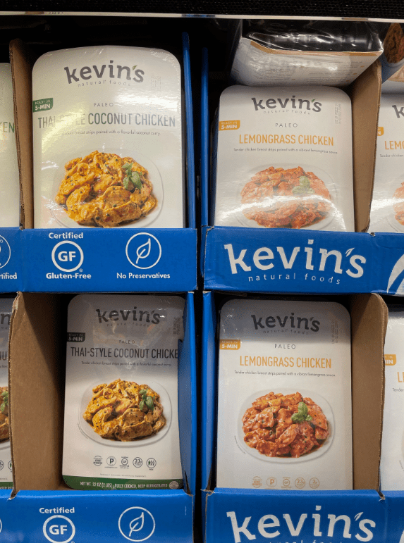 Containers of kevin\'s chicken in various flavors.