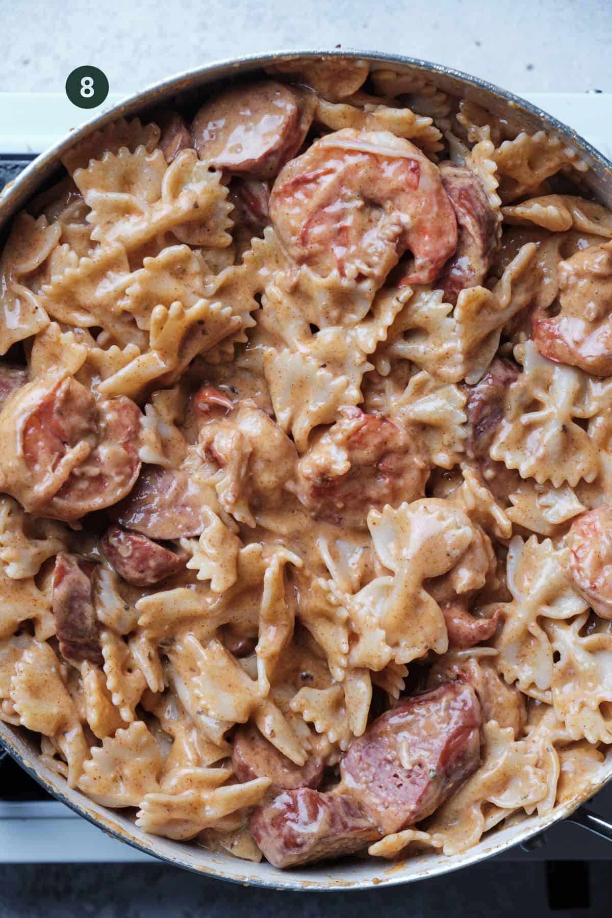 Sausage and shrimp added back to the pasta and mixed together. 