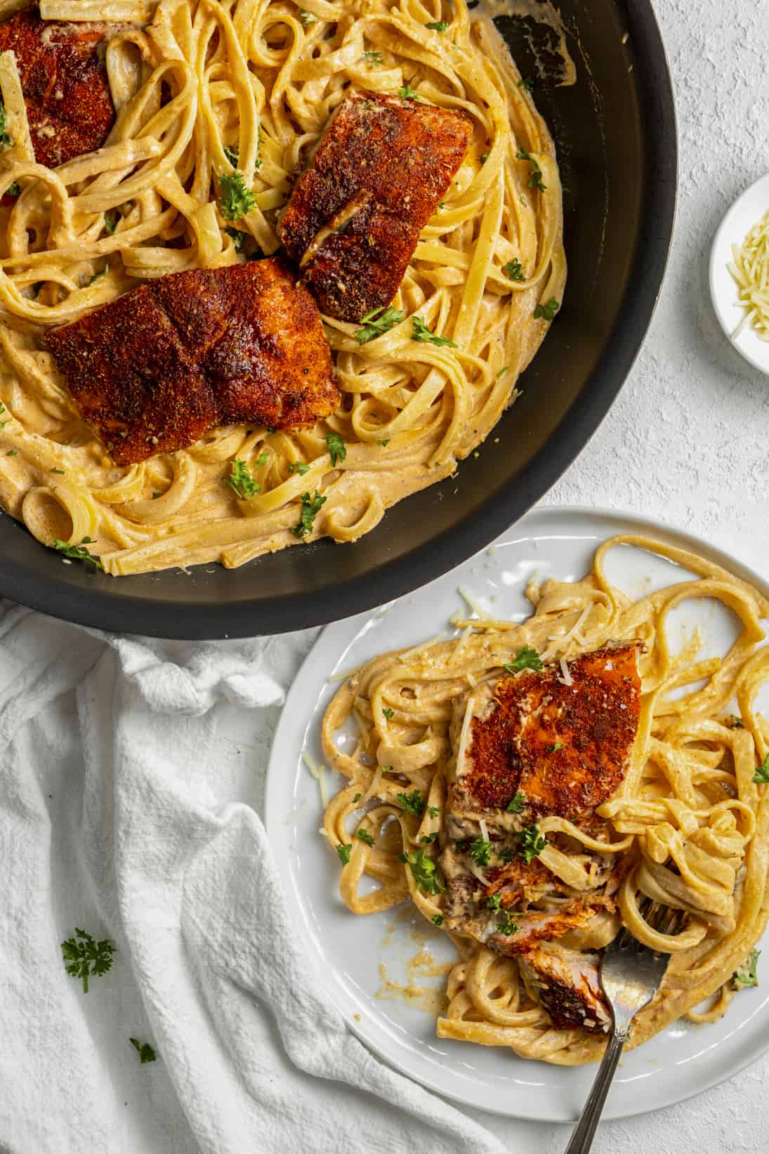 Salmon in a creamy pasta with fettuccini noodles.