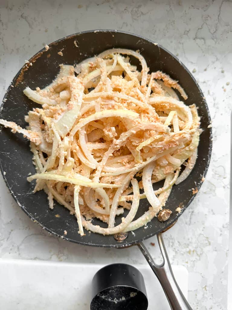 Onions coated in breading for air frying. 