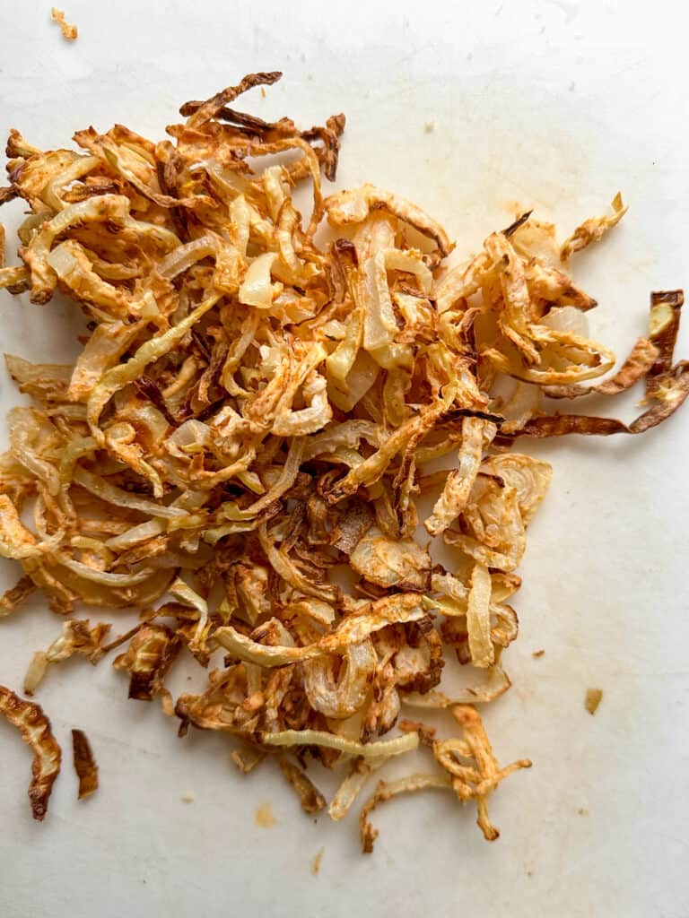 Crispy air fried onions after being cooked.