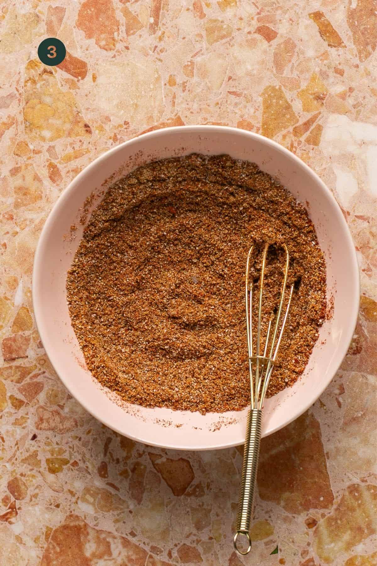 Taco seasoning mixed in a small bowl.