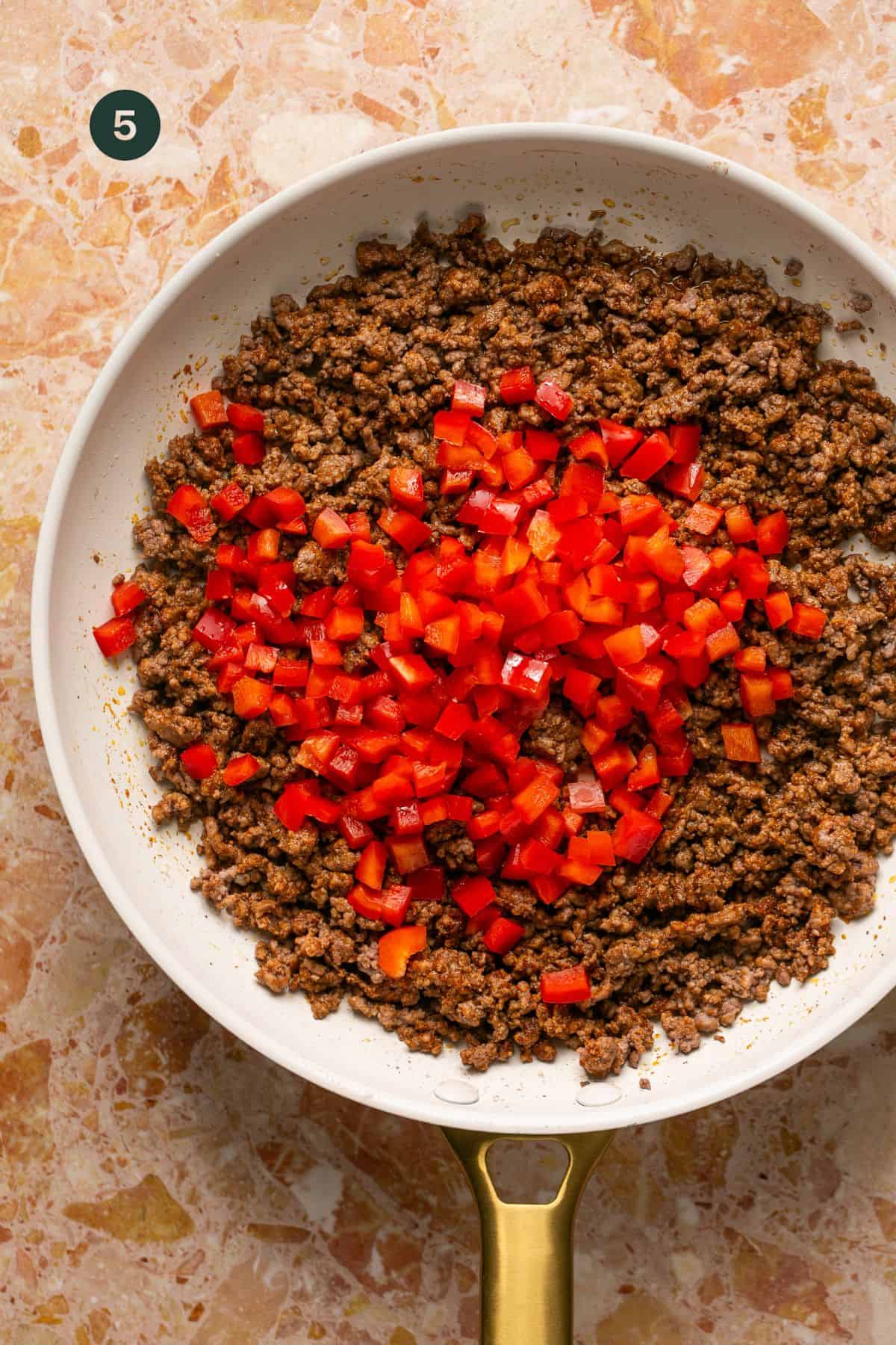 Bell peppers added to the meat mixture.