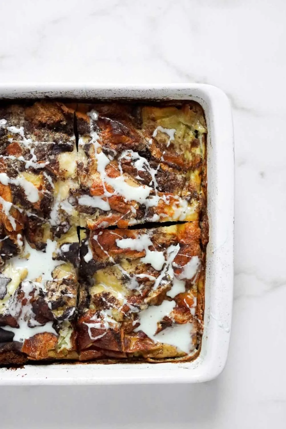 Cinnamon roll French toast egg bake in a baking dish.