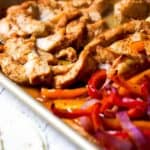 Chicken and vegetables on a sheet pan.