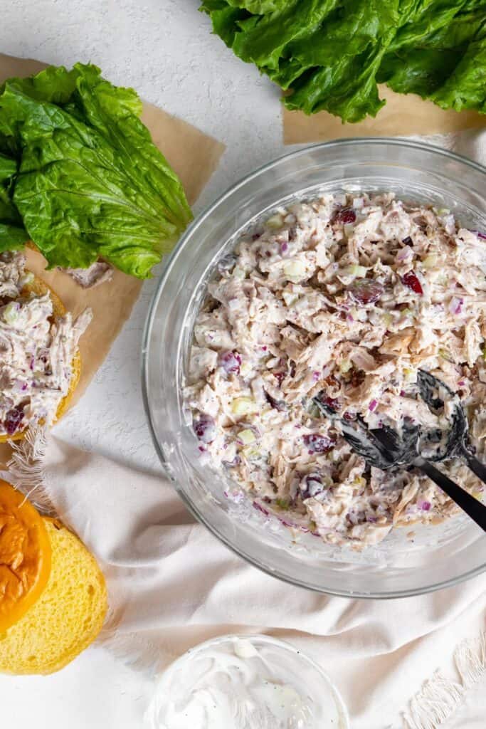 Bowl of California chicken salad with two spoons.