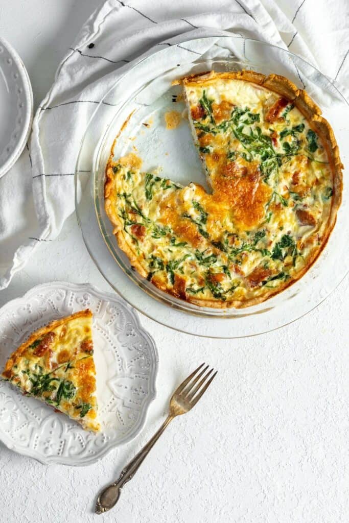 Egg white quiche in a pie dish and on a plate.