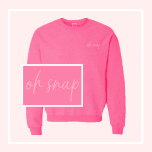 Pink sweatshirt with text "oh snap."