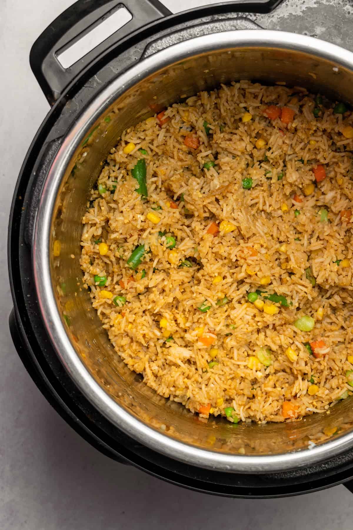 Fried rice with vegetables in the base of the instant pot. 