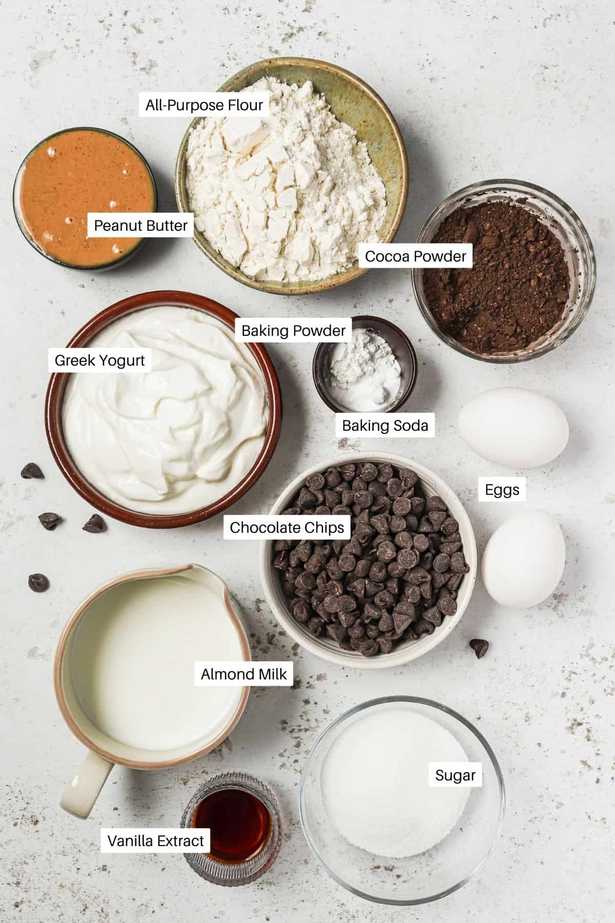 Flour, baking soda and powder, salt, eggs, peanut butter, greek yogurt, milk, sugar and vanilla. 