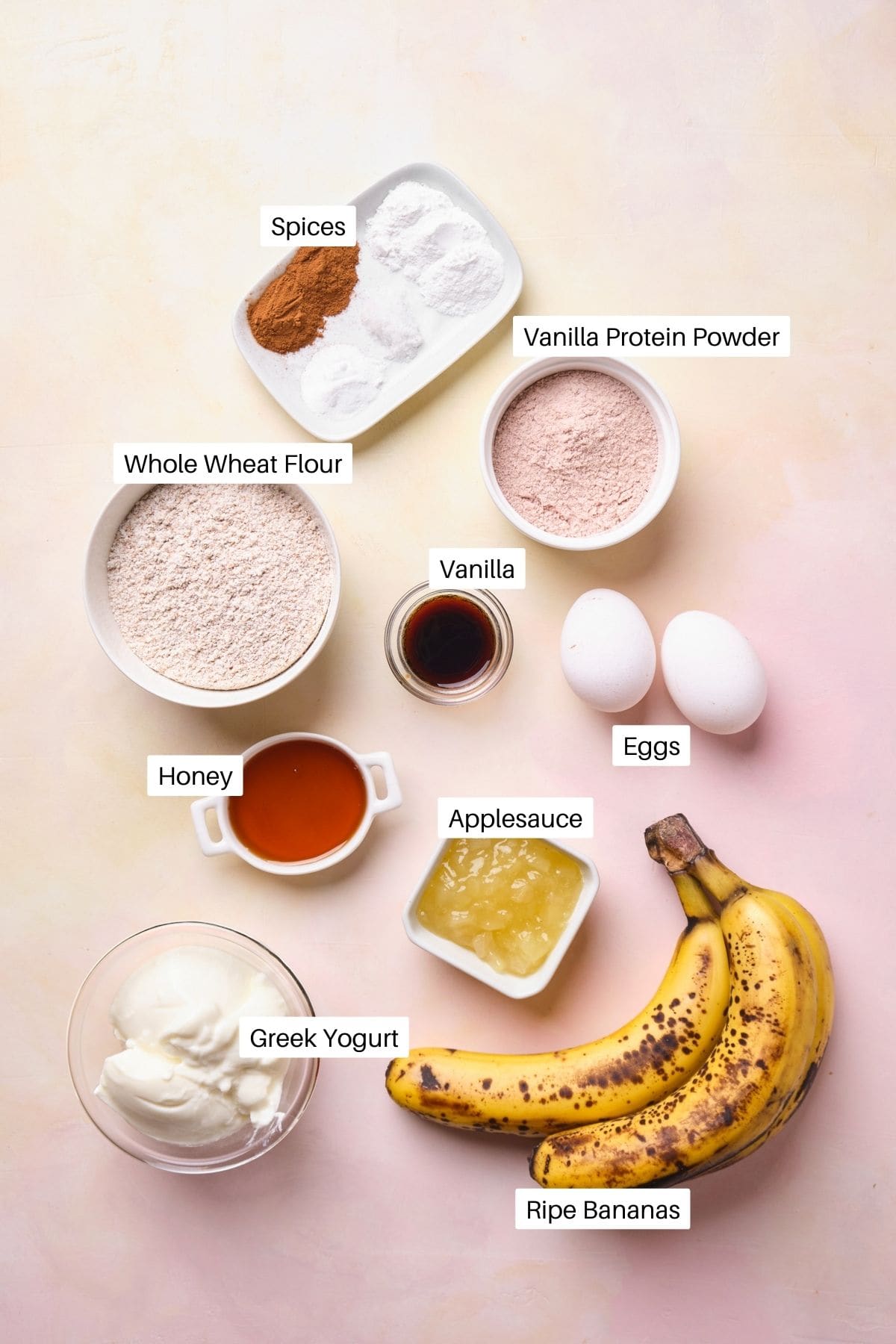 Ingredients for protein banana bread, including applesauce, Greek yogurt, and vanilla protein powder.