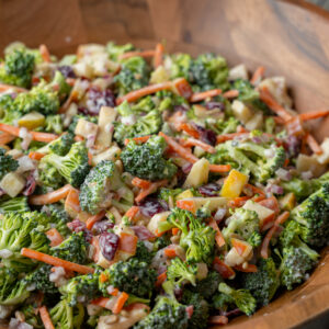 Broccoli crunch salad in a wooden bowl.