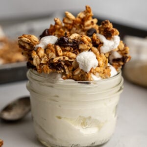 Jar of yogurt topped with s'mores granola.