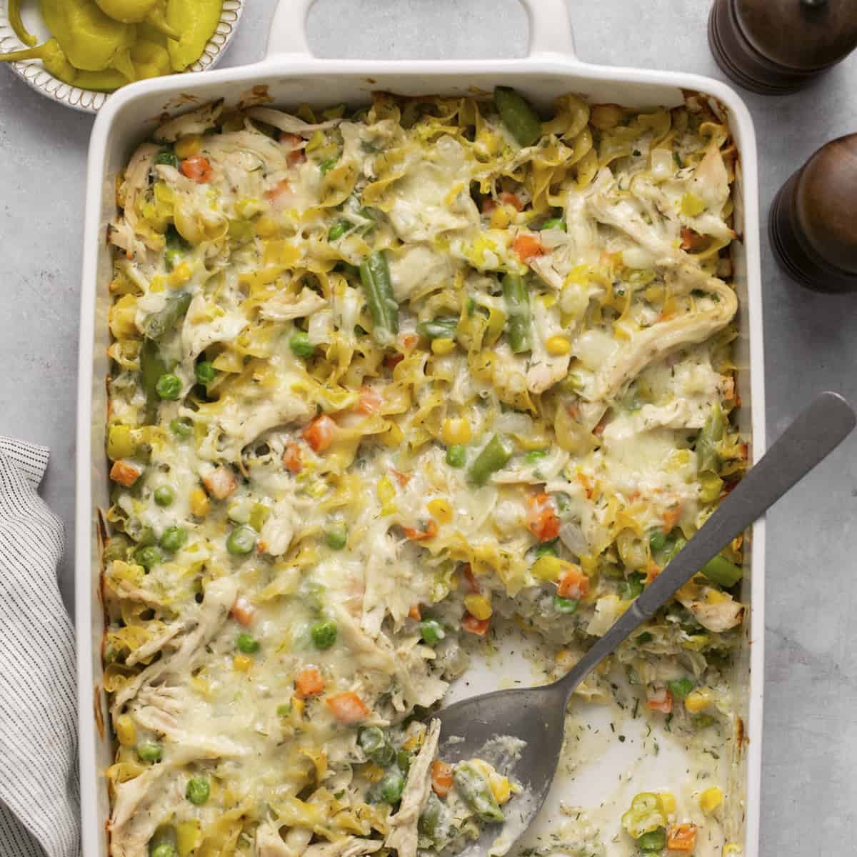 Chicken casserole fully baked with a spoon.