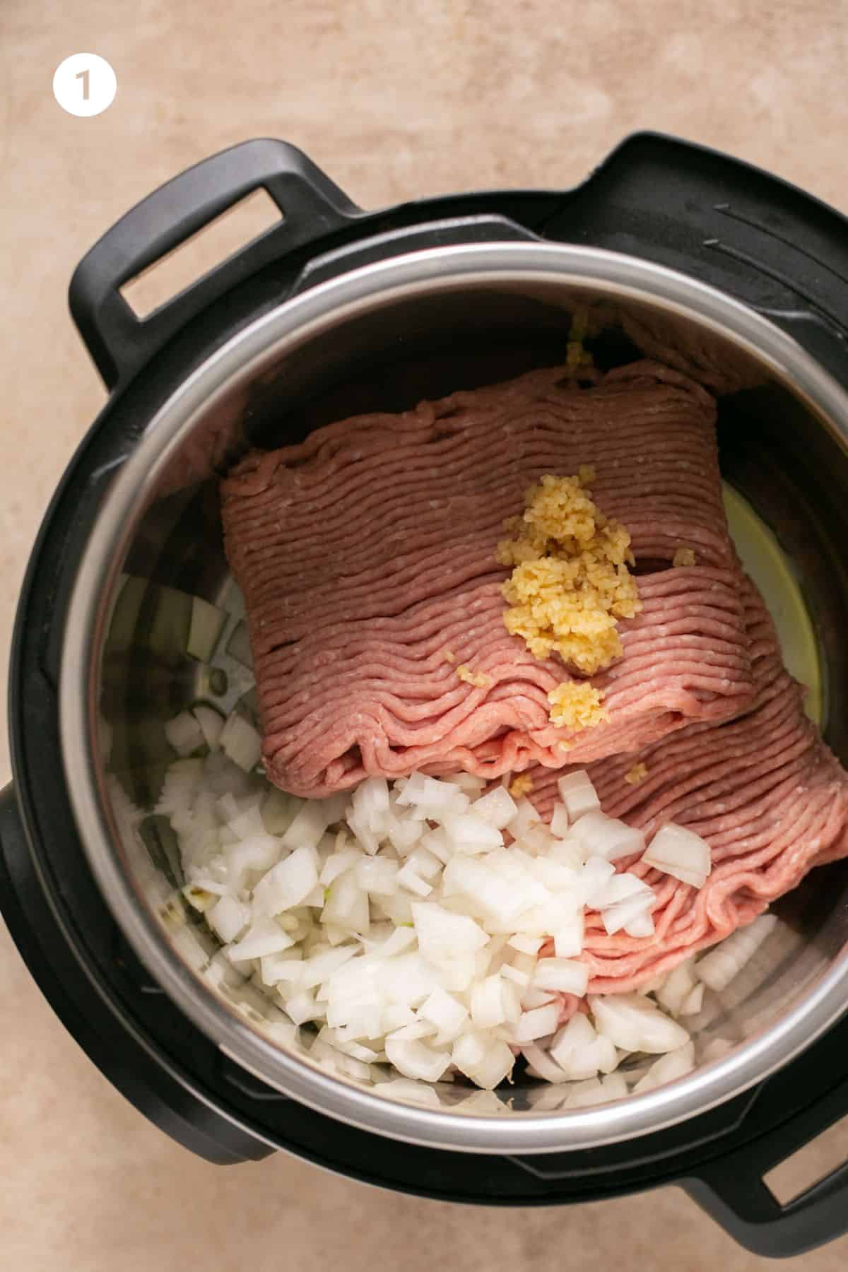 Onion, garlic and ground turkey in the instant pot. 