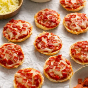 Air fryer pizza bagels on a white surface.