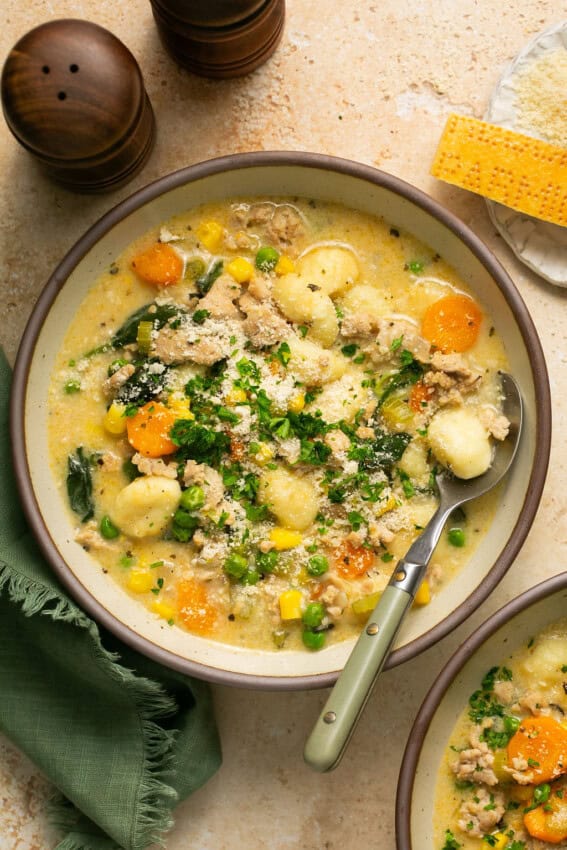 Spoon in a bowl of Chicken Gnocchi Soup.