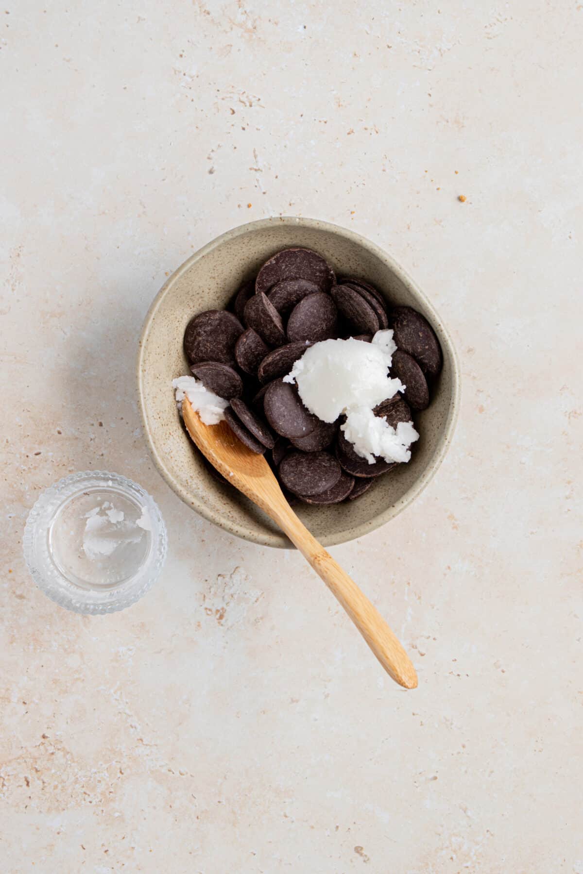 Chocolate chips with coconut oil in a small bowl. 