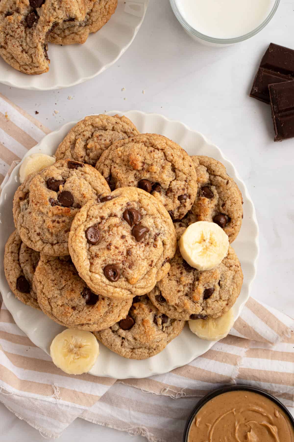 Cookies on a plate with sliced banana and chocolate. 