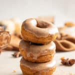 Stack of mini pumpkin donuts.