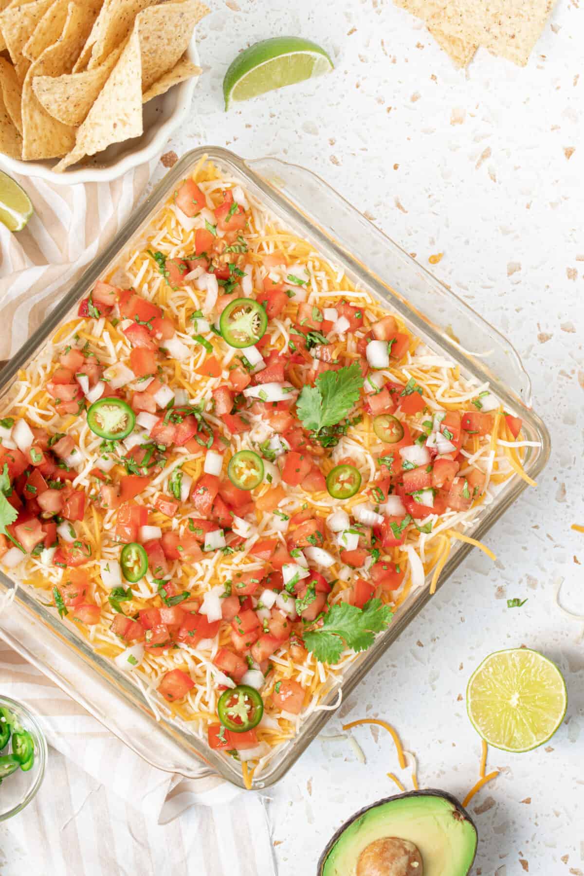 Five-layer dip in a square glass dish.