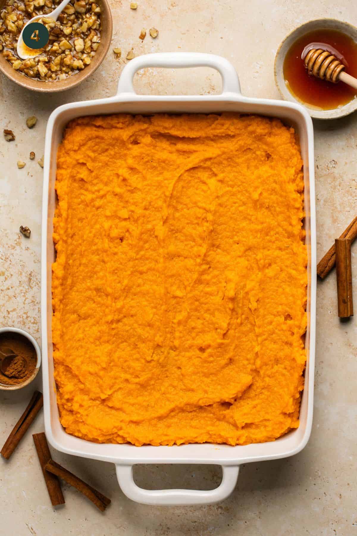 Sweet potato mixture fully combined with add ins and spread in a single layer of a 9x13 inch baking dish. 