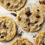 Chocolate chip cookies with one broken in half.