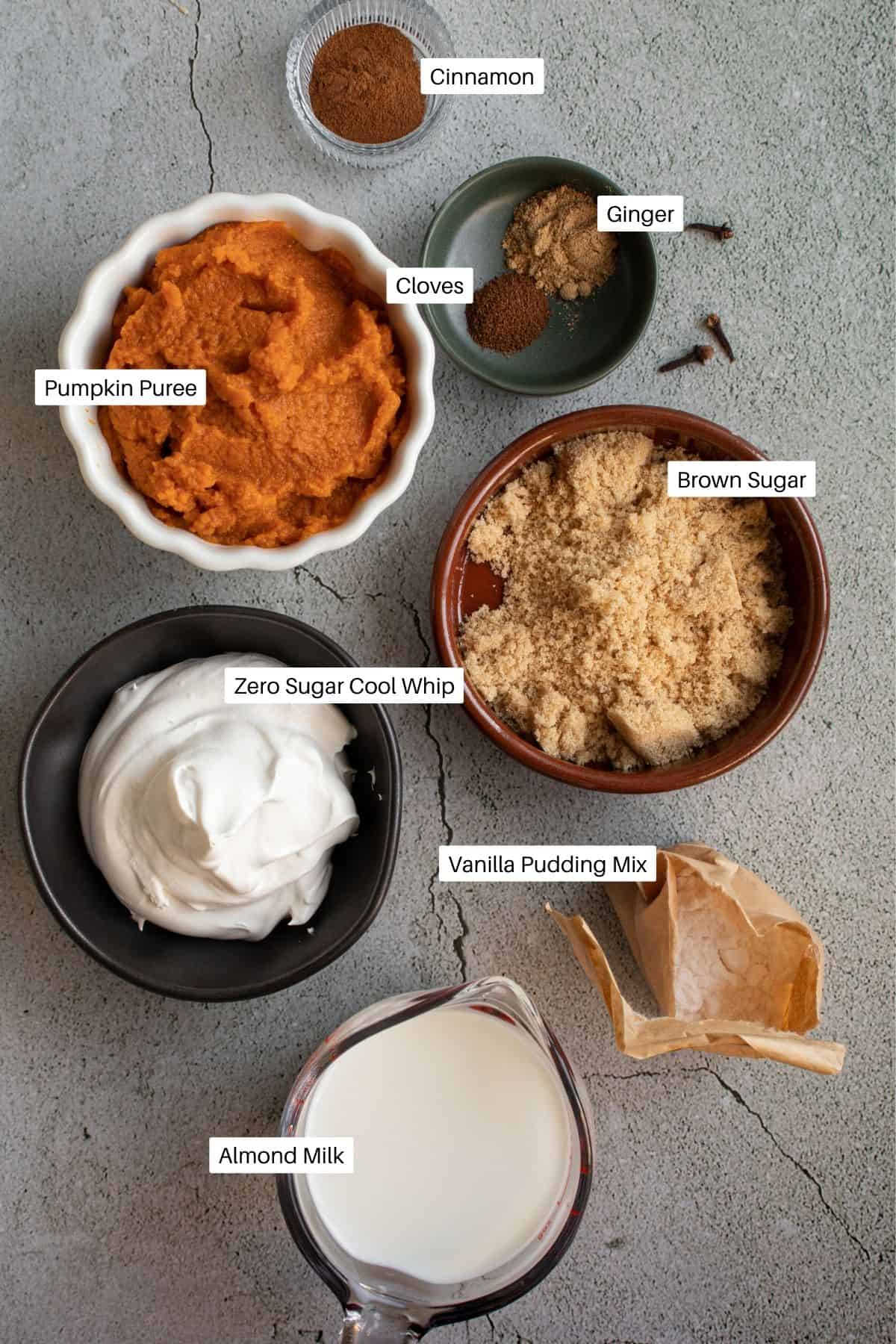Bowls of ingredients including brown sugar, cinnamon, and almond milk.