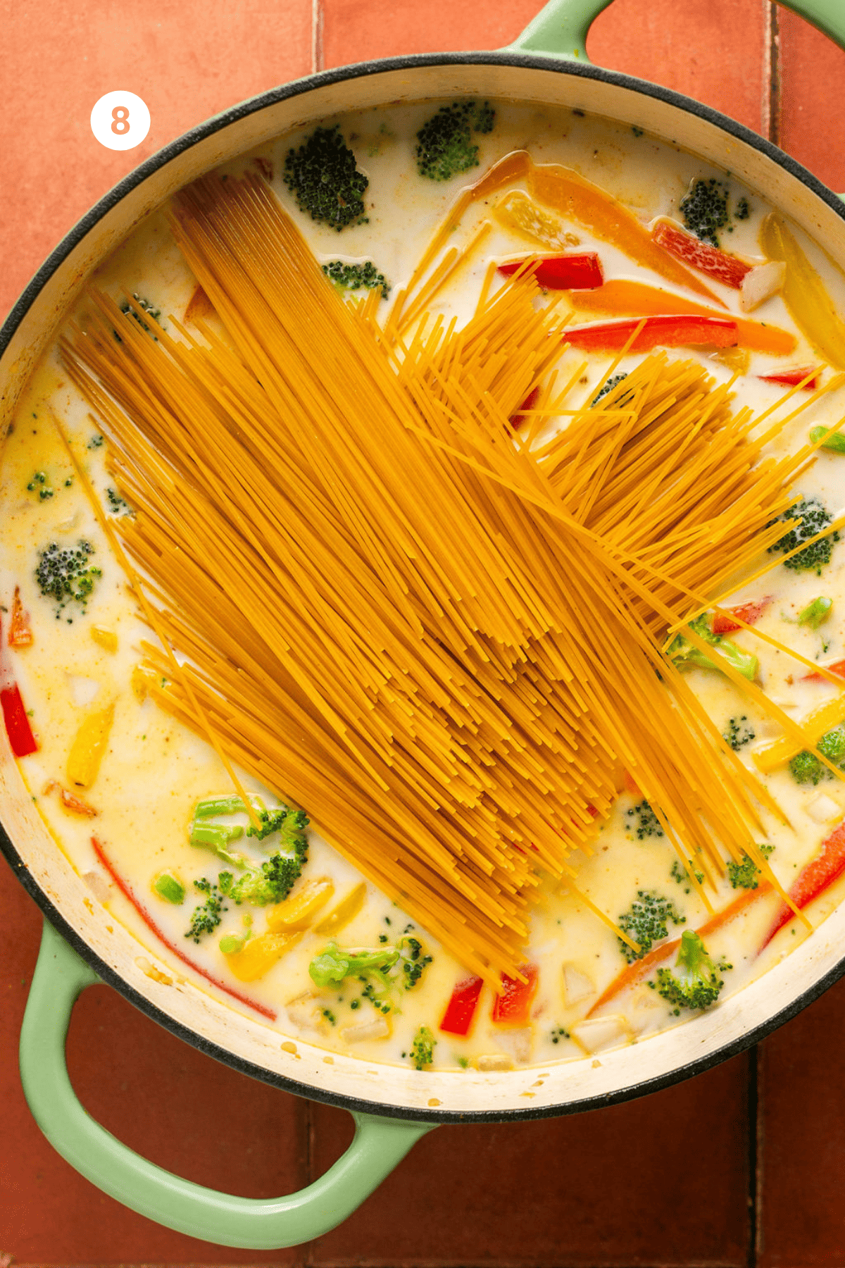Broken spaghetti noodles added on top in a crisscross pattern.
