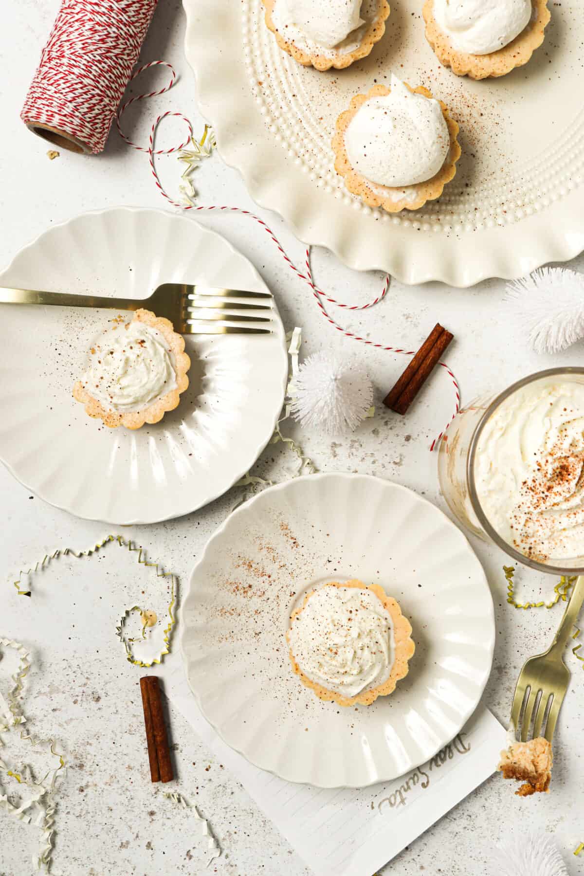 Mini cheesecakes plated to enjoy with a fork. 