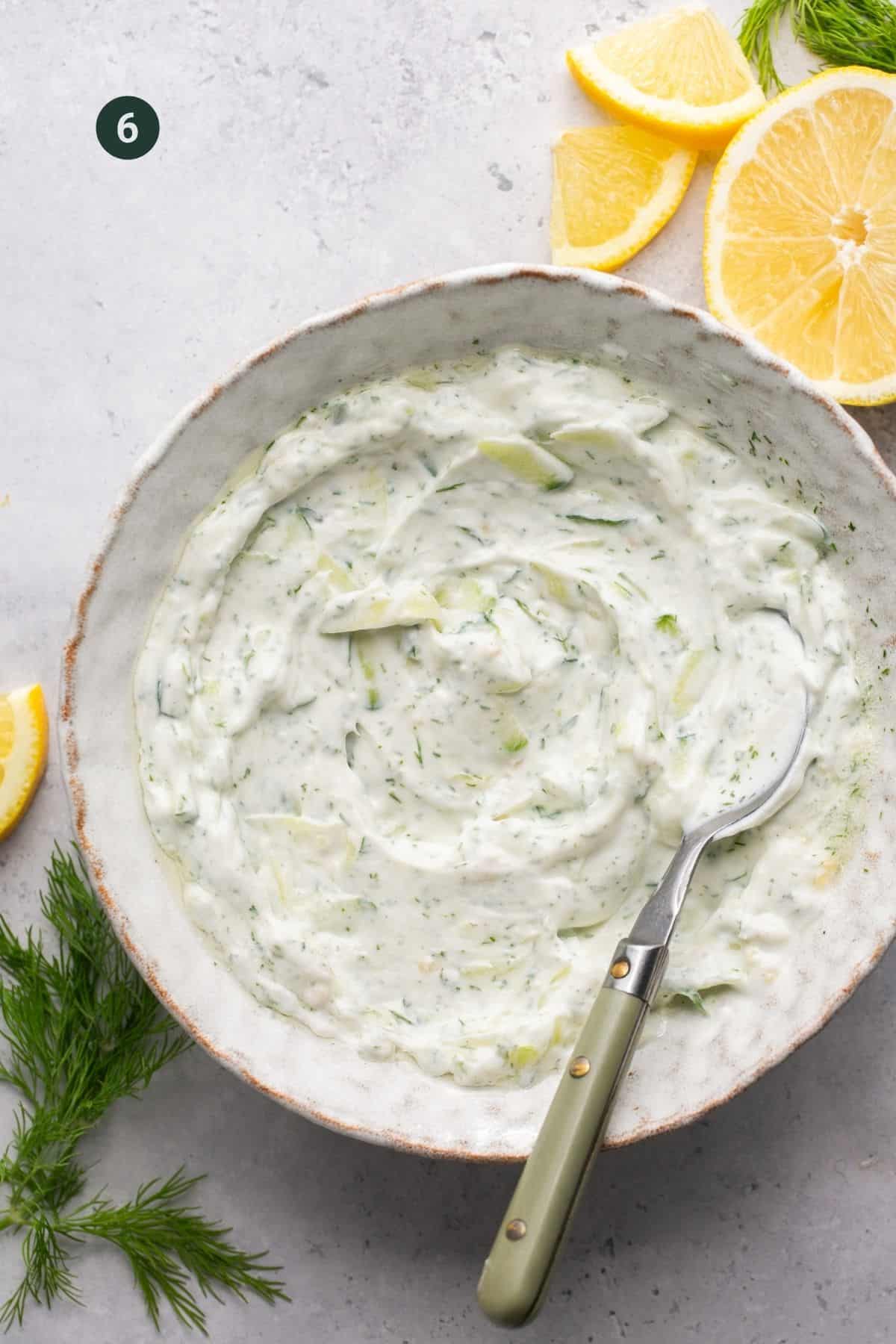 Fully mixed and combined tzatziki sauce. 