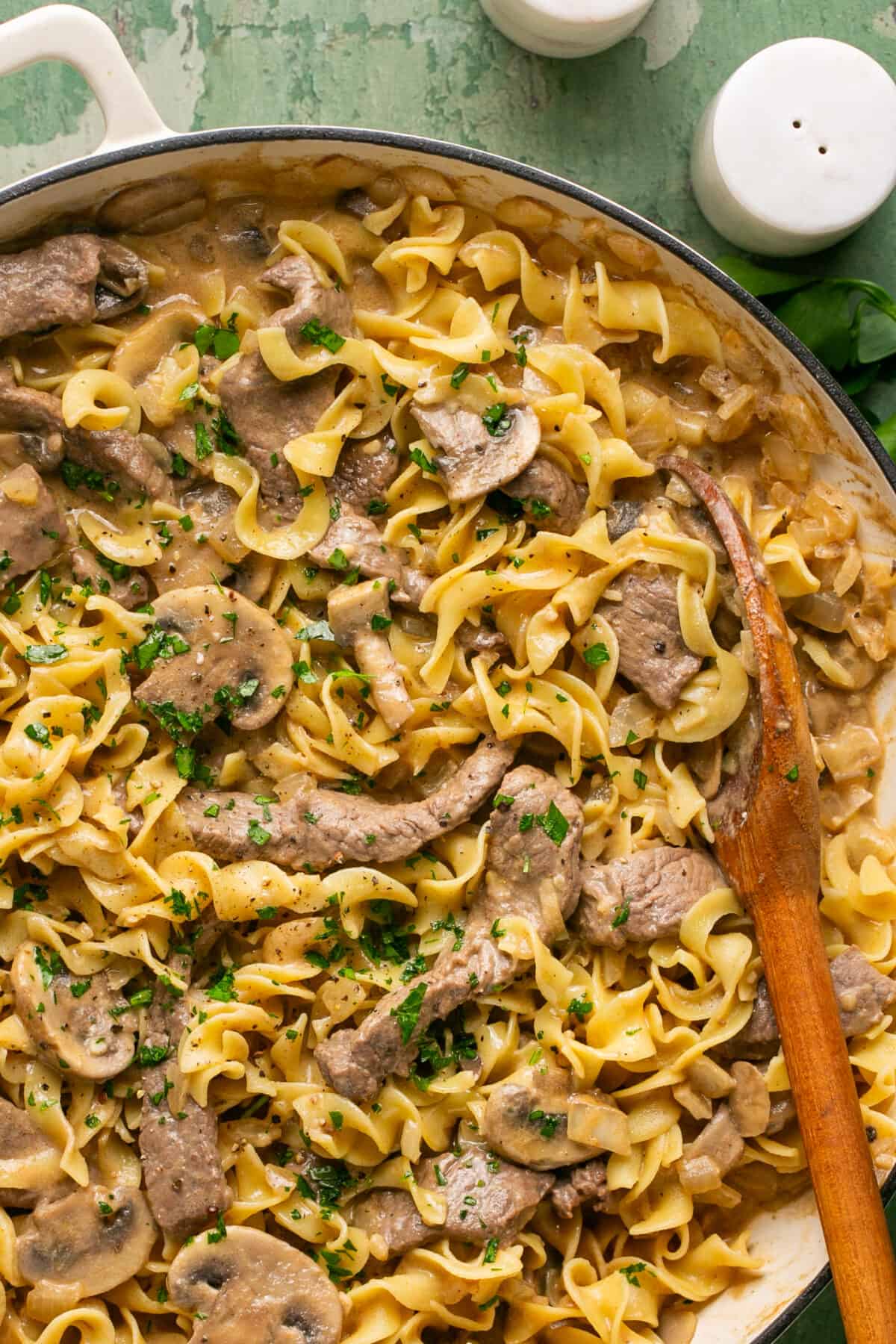 Fully combined mushroom sauce, beef and noodles in a pan to serve. 