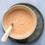 Fully mixed sauce in a small bowl with a spoon.