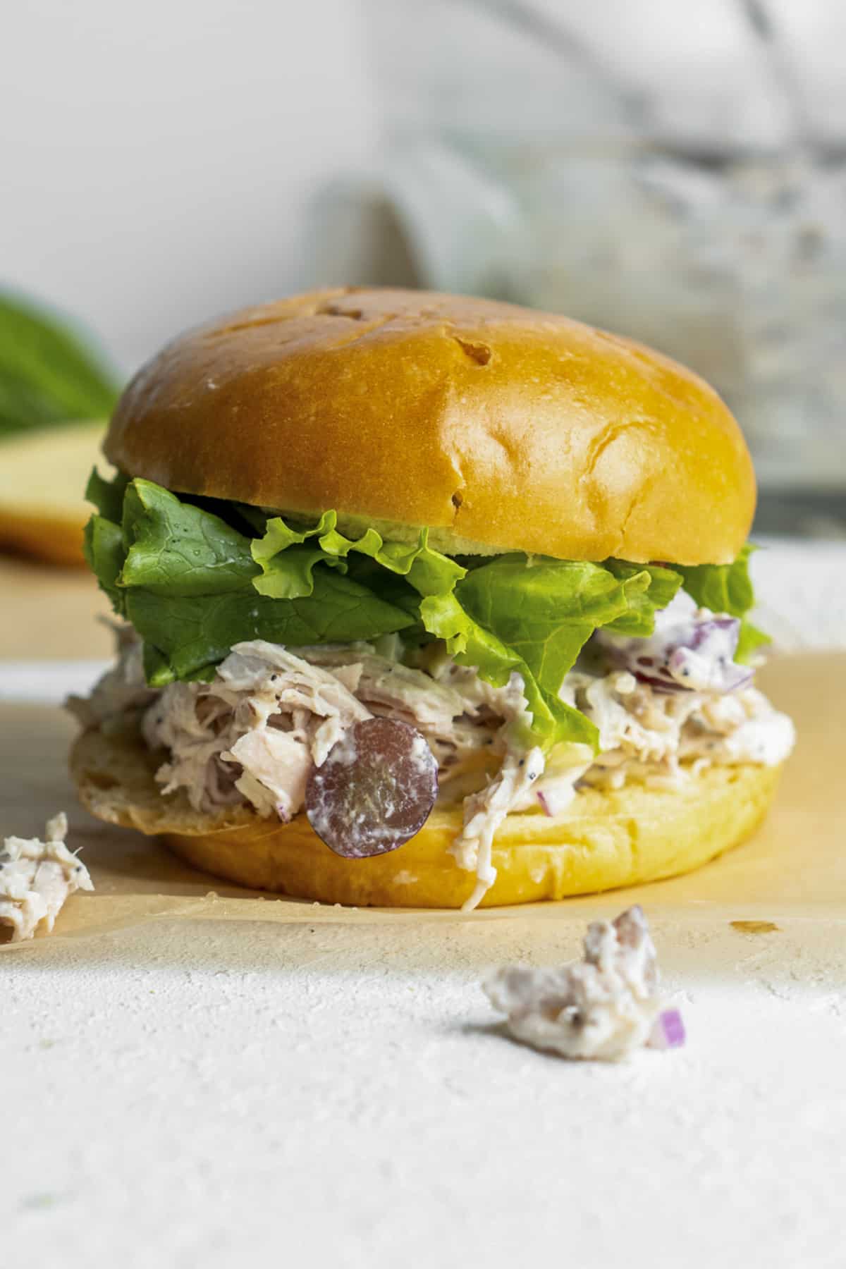 Chicken salad on a bun with lettuce. 
