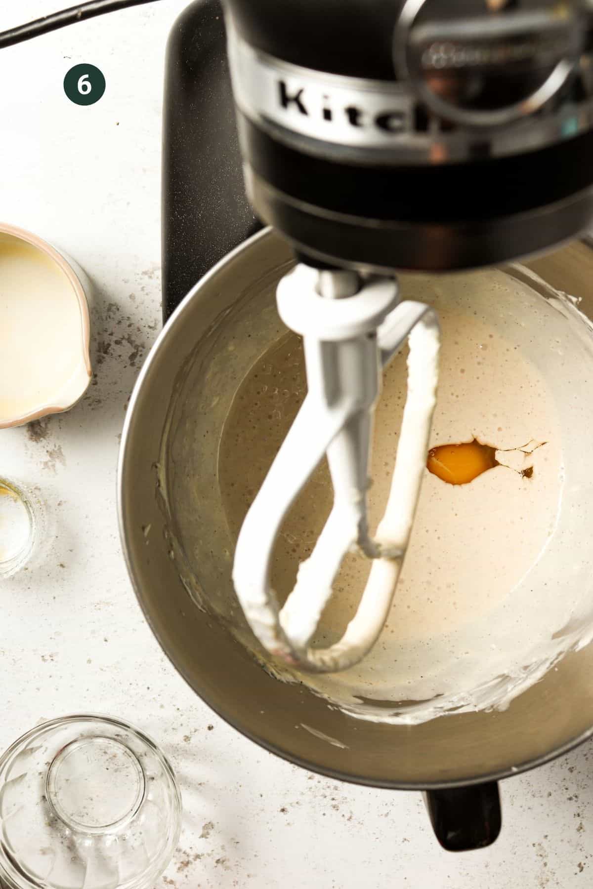 Egg added to the mixer to mix into the mixture. 