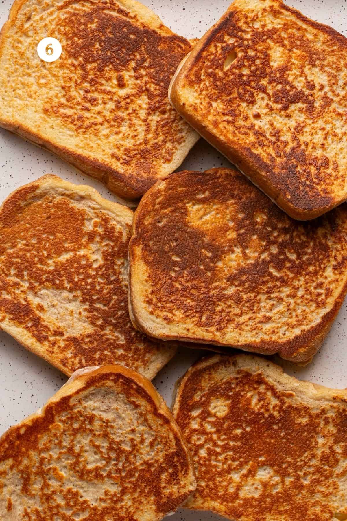 All six pieces of french toasted browned on both sides. 