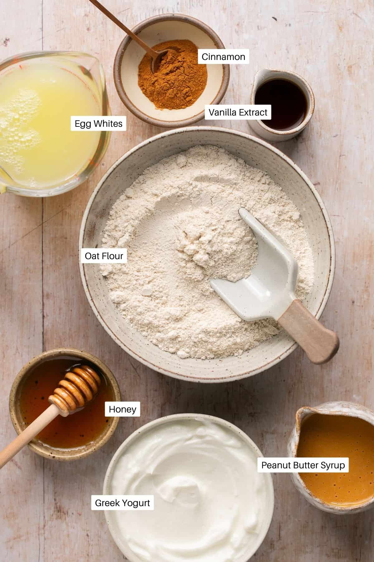 Oat flour, cinnamon, egg whites, vanilla extract, honey, greek yogurt and peanut butter sauce for the pancakes.