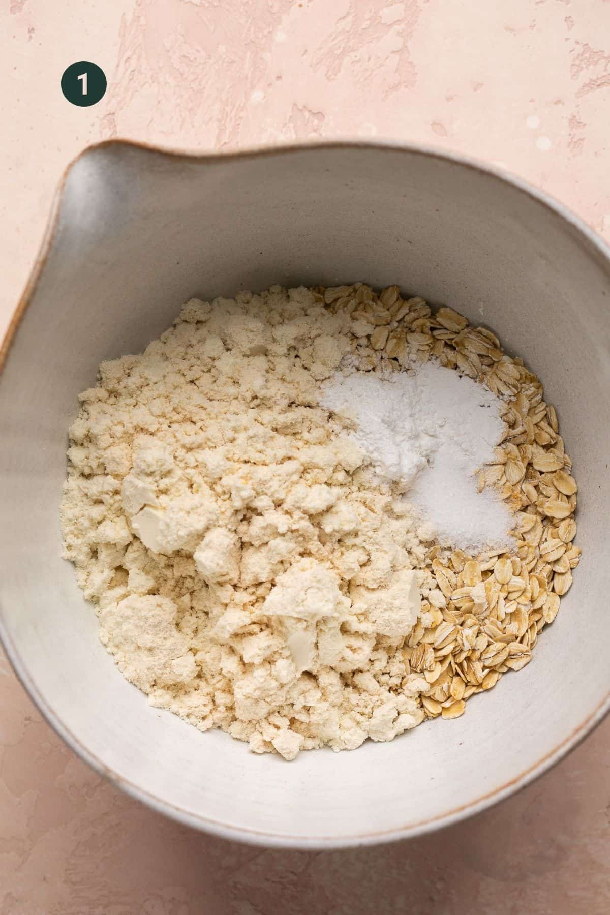 Baking powder, oats, protein powder and salt added to a bowl to combine. 