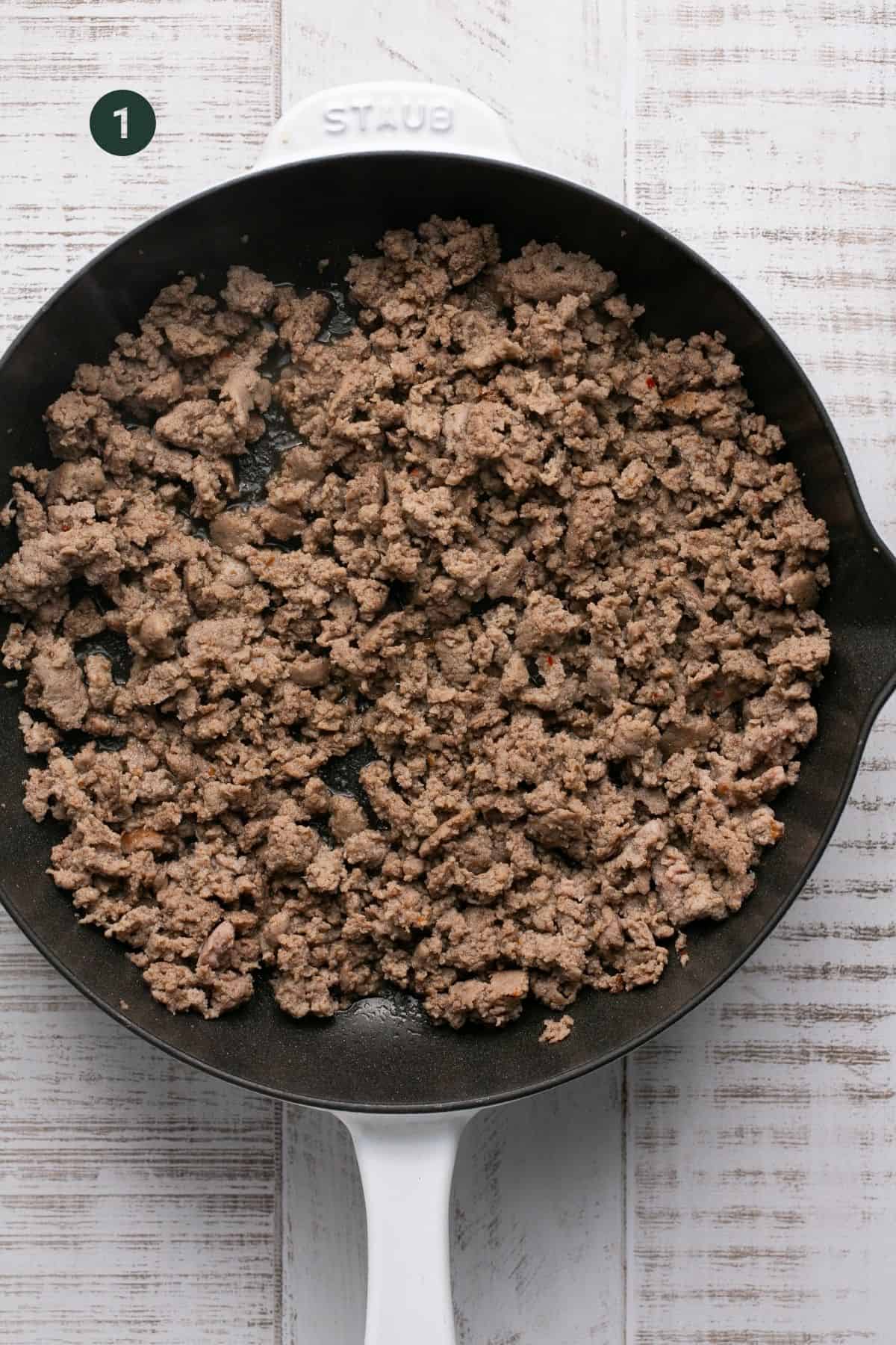 Browned ground turkey sausage in a pan.
