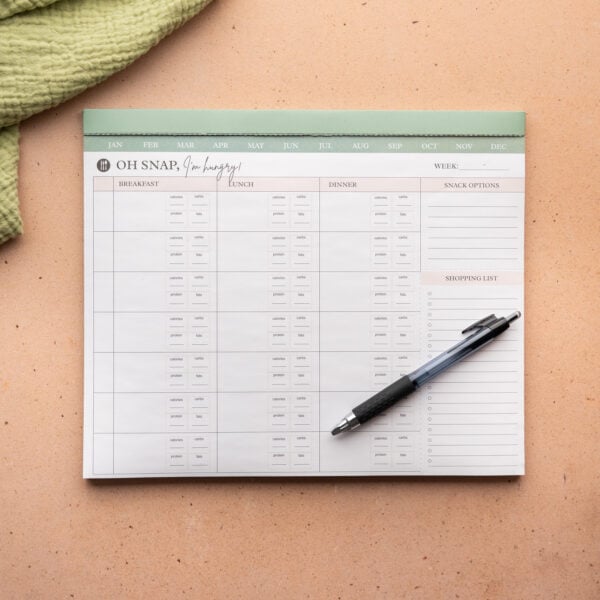 Meal planner with a pen.