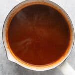 Thickened barbeque sauce in a sauce pan.
